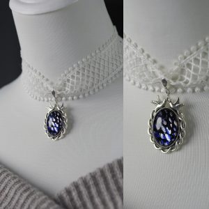 Black background hot silver splashed ink blue